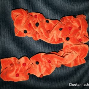 Handstulpen aus Samt in Orange mit Bommeln